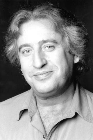 Louis Saïa as Raymond, Dédé's agent in Through the Mist