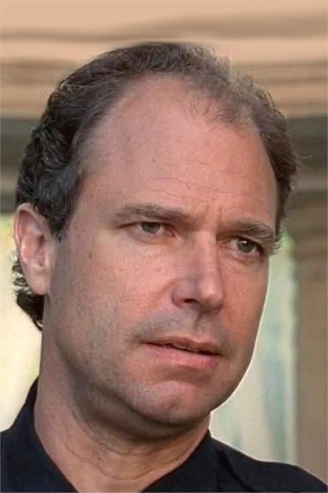 Malcolm Stewart as Father McClellan in Beauty