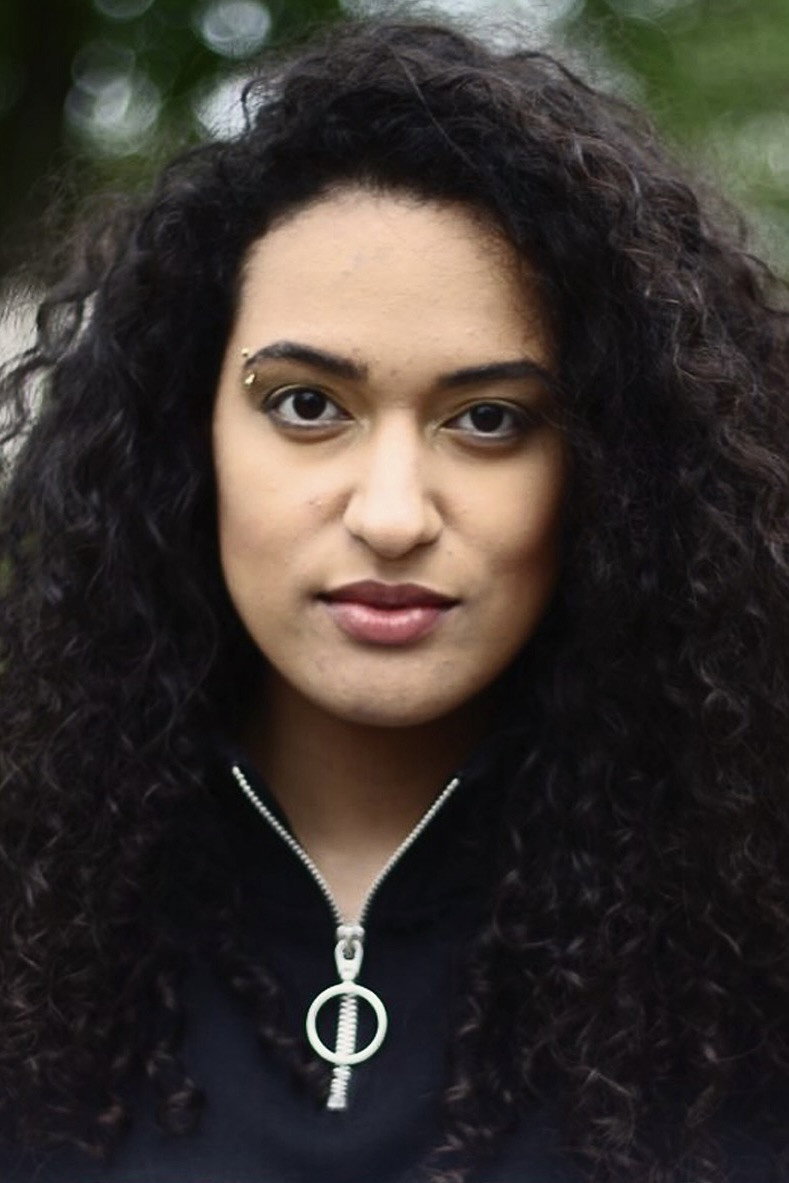 Juliana Barros as Miss Stacey in Physique