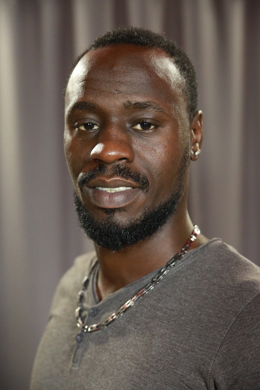 Oumar Diolo as Alassane in Earth and Blood