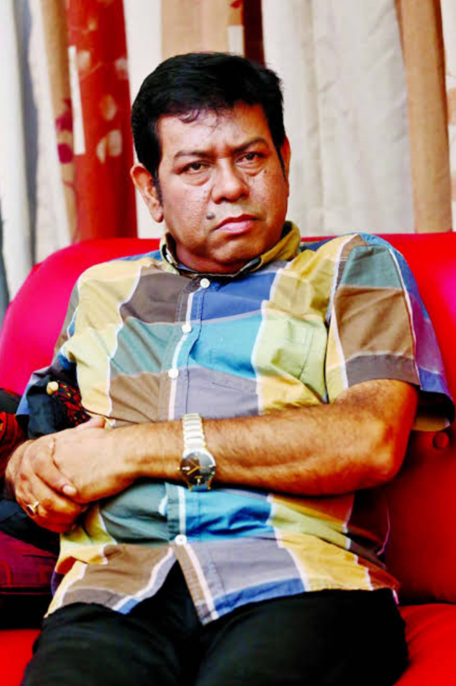 Nader Chowdhury as ADC Kader (as Assistant District Commissioner of Ratanpur) in Mad_e in Bangladesh