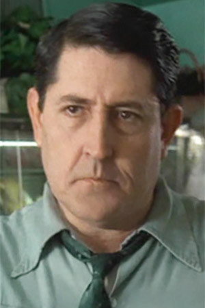 Dana Craig as Mr. Mueller in Running Time