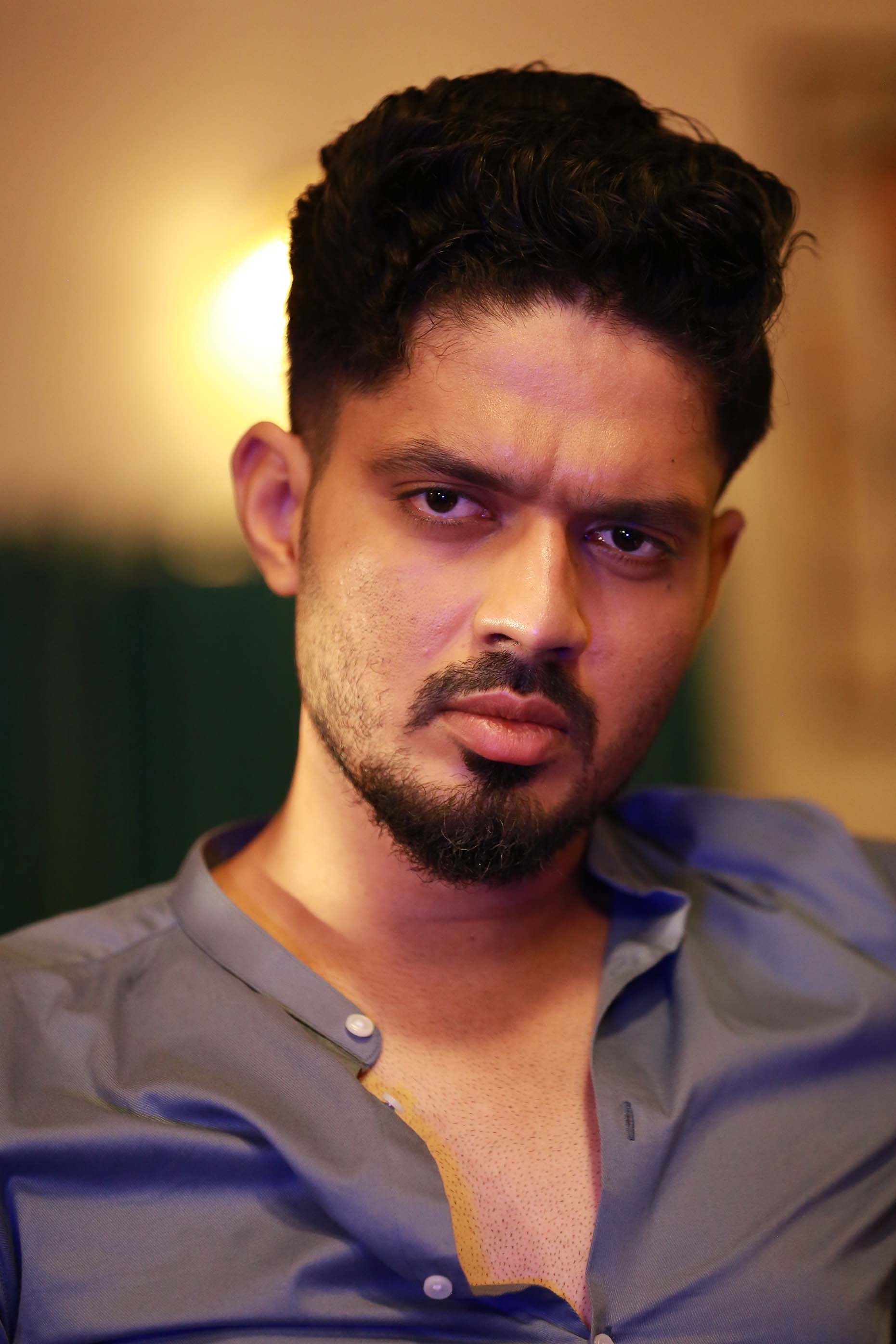 Praveen Elangho as Santhosh in Amigo