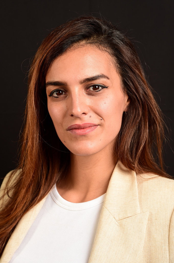 Dina Amer as Adult Hasna in You Resemble Me