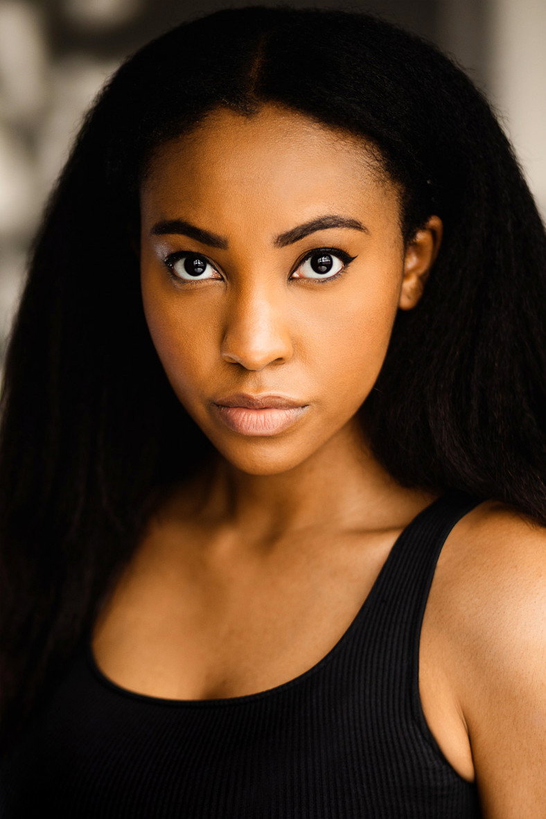 Malaika Hennie-Hamadi as Cashier in Diaspora