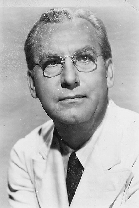 Emmett Vogan as Police Capt. Brown in The Lady Confesses
