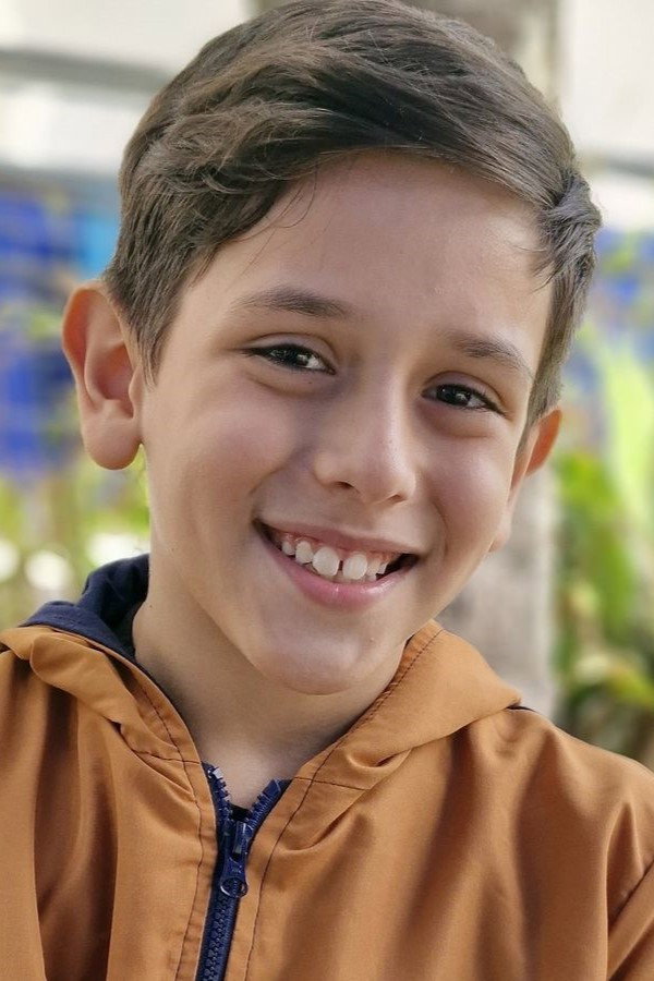Lucca Almeida as Boy in the Bike in Uma Primavera