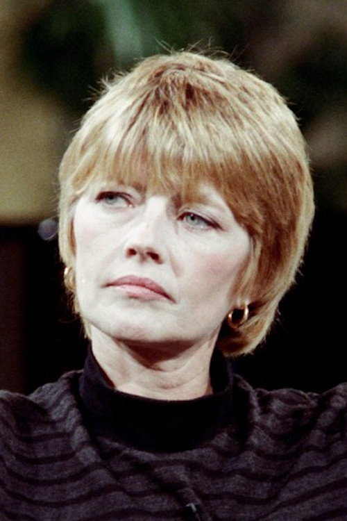 Claire Bretécher as TV Journalist in Roads to the South