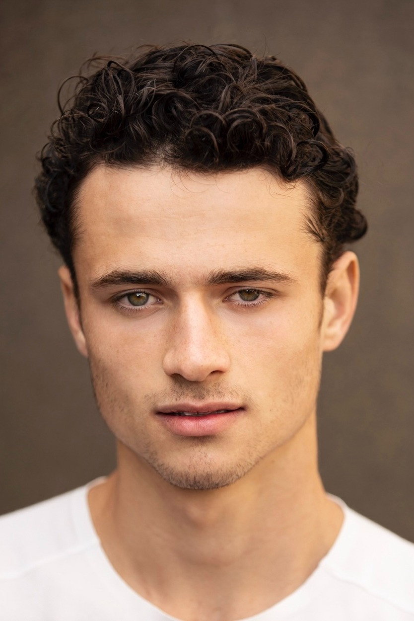 Nick Bisa as Travis Hall in Roosters