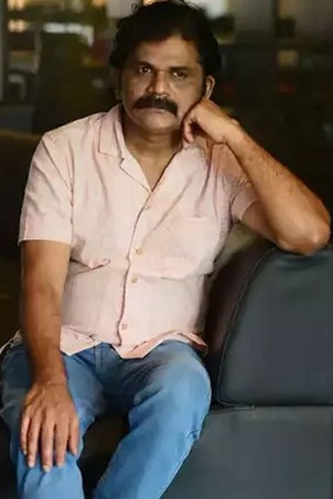 James Eliya as Lakshmi Narayanan Mash in Samadhana Pusthakam