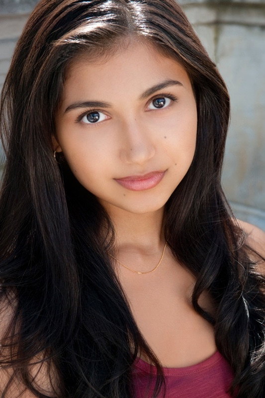 Agneeta Thacker as Amy Wally in A Light Beneath Their Feet