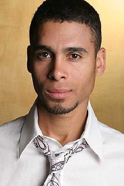 Wilson Jermaine Heredia as Angel Dumott Schunard in Rent