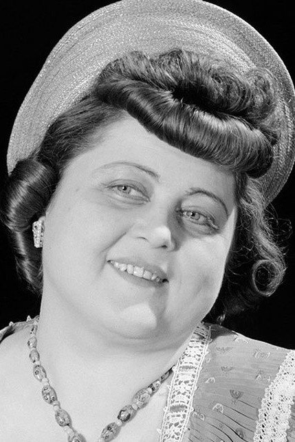 Márta Fónay as Mrs. Körmendi - Árpi's mother in Házasságból elégséges
