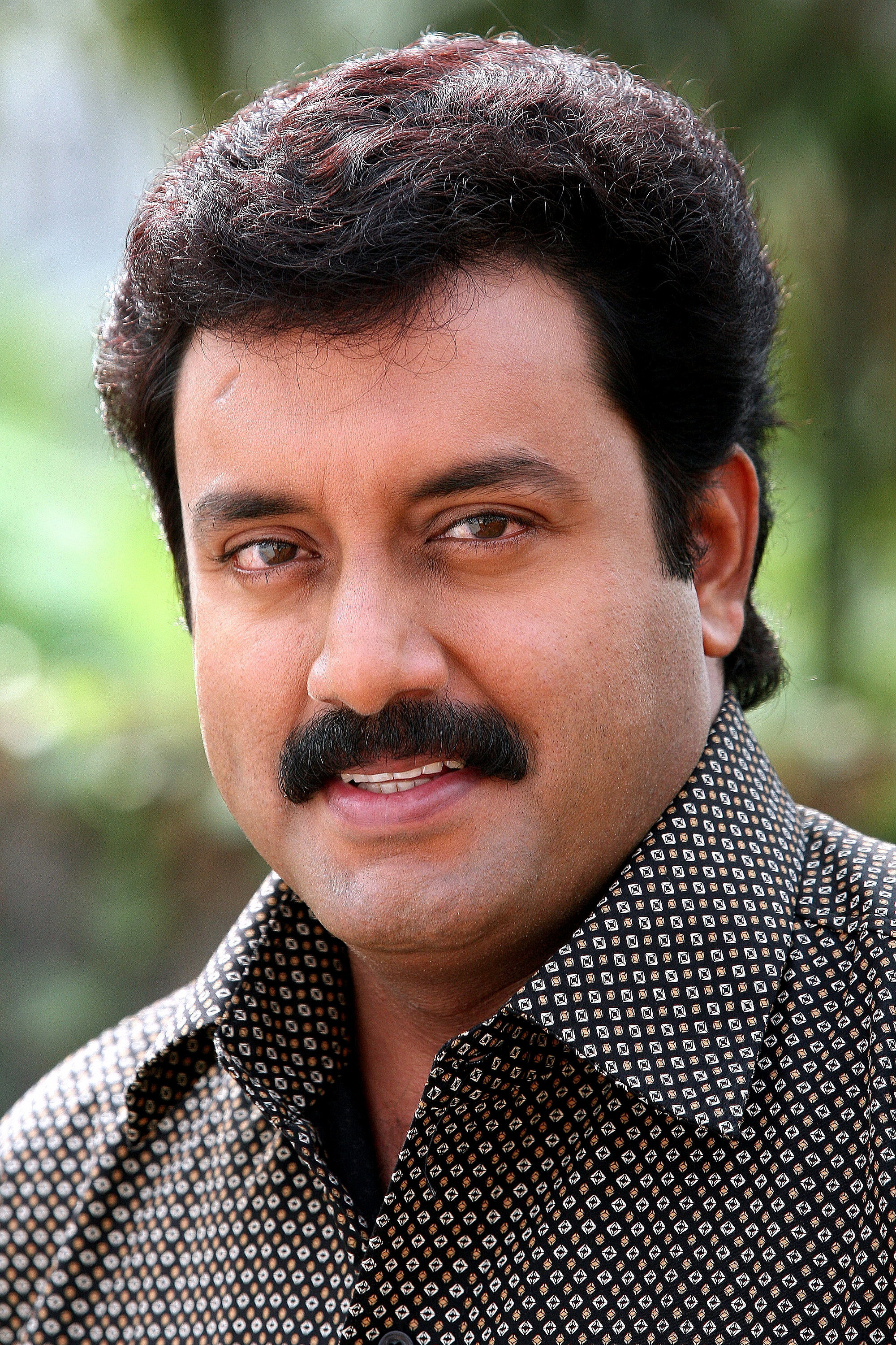 Suresh Krishna as Sudheesh Menon in Odum Kuthira Chadum Kuthira