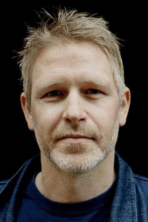 Trond Espen Seim as Statsminister Michael Woll in Mammon