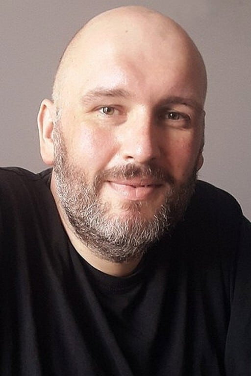 Michał Piela as Kokosz (voice) in Kayko and Kokosh