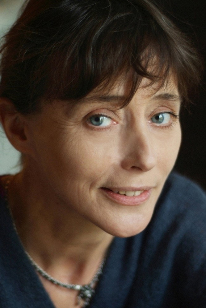 Mireille Perrier as Assistant in La Patinoire