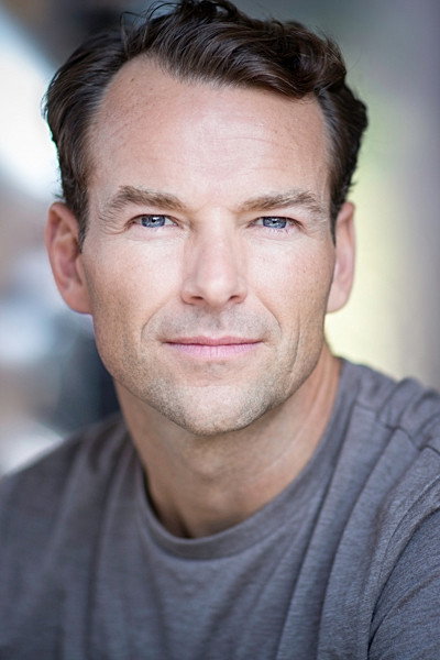 Michael Absalom as Reporter in Solitary