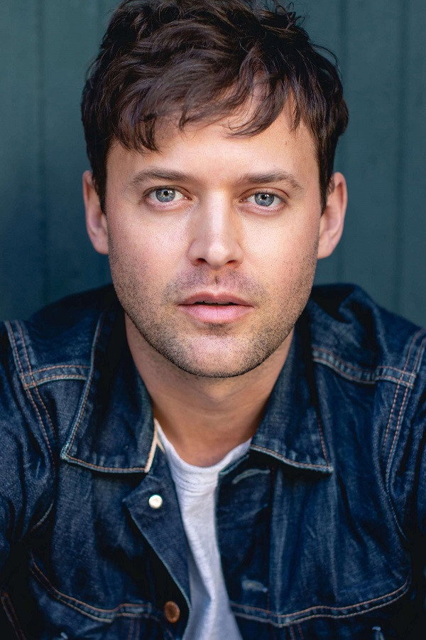 Oliver Ackland as Alex Blake in Secret Bridesmaids' Business