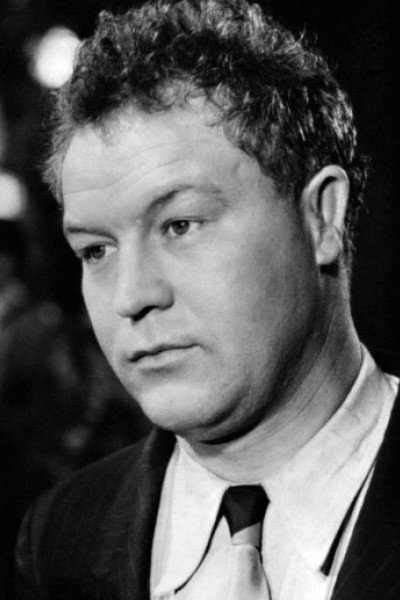 Daniel Ivernel as Police Inspector Adrien Massar in La Fête à Henriette