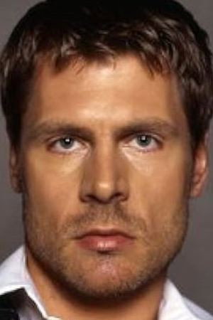 Sven Garrett as The Photographer in Girls Wanted