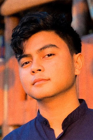Carlos Dala as Mila's Son in The Woman in the Septic Tank