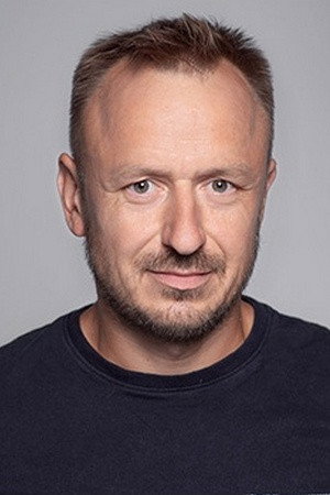 Wojciech Kałużyński as Coach in Wróbel