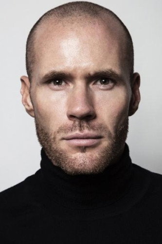Oliver Trevena as Officer Garrett in Grand Isle
