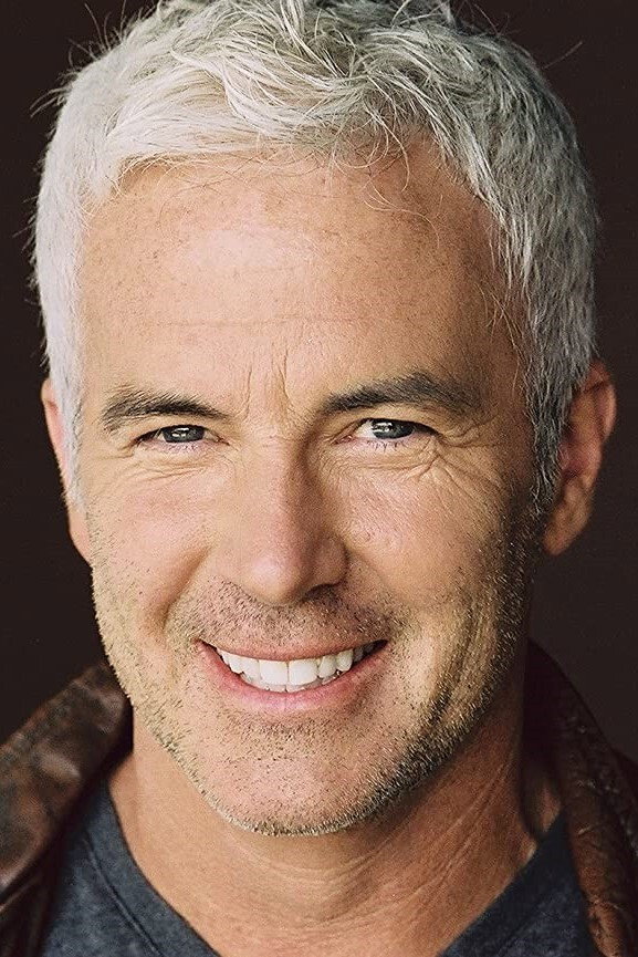 John Burke as Host in Last Mysteries Of The Titanic