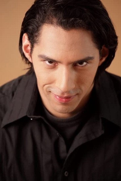 Alex Llera as Zeus in Veronique Von Venom: Horror Hostess Hottie