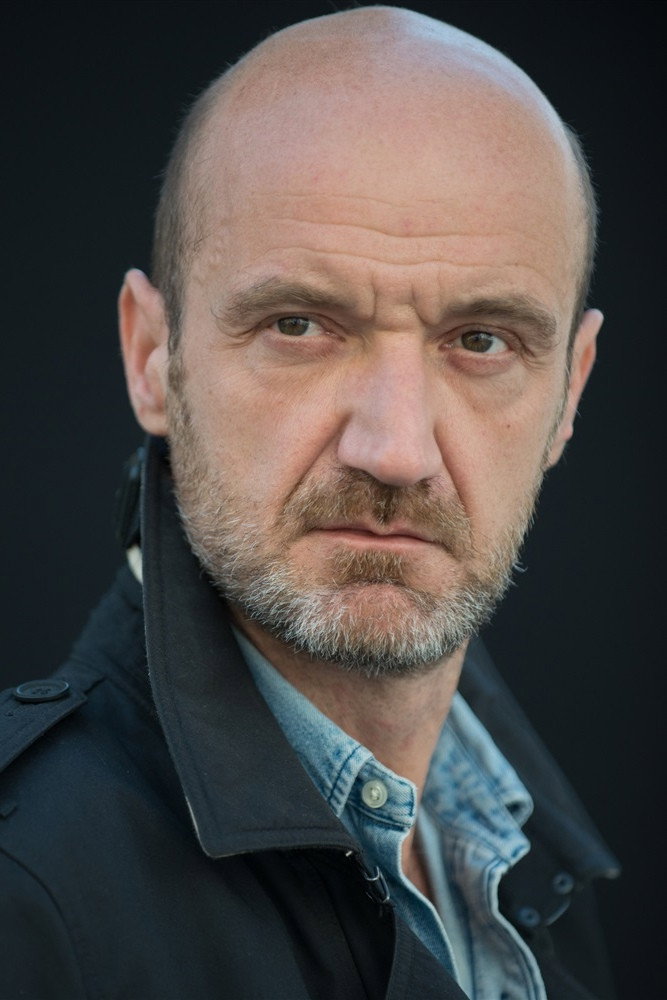 Frédéric Maranber as Boss Charrière in Her & Him & the Rest of the World