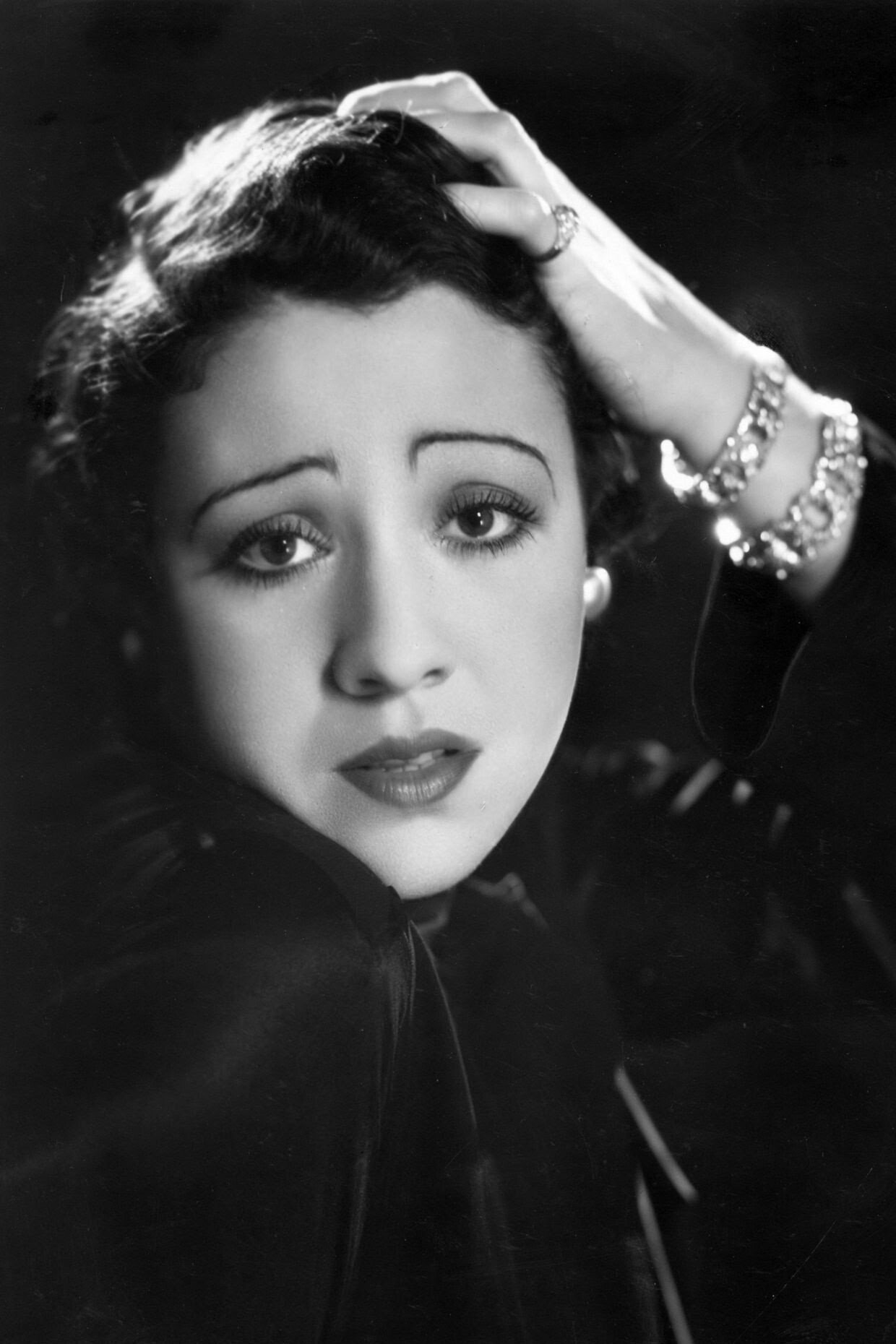Mireille Perrey as Tante Élise in Les Parapluies de Cherbourg