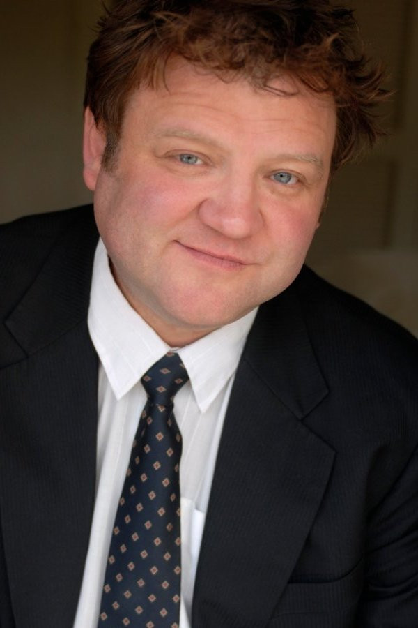 Peter Flaherty as Muz in The Debt Collector
