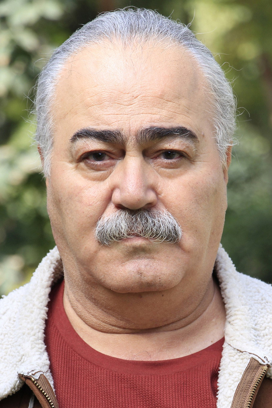 Bijan Ganjali as Manouchehr (Father of Arsalan) in Liberation