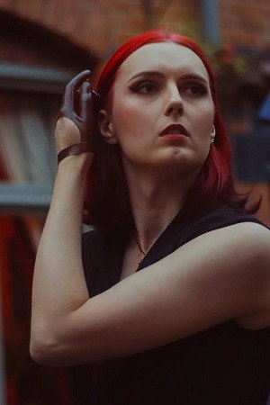 Kat B. as Katie in The Moon is a Hologram