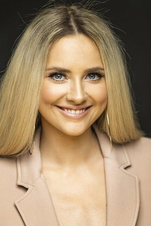 Brigitte Susanne Hunt as Host in Love Regiment