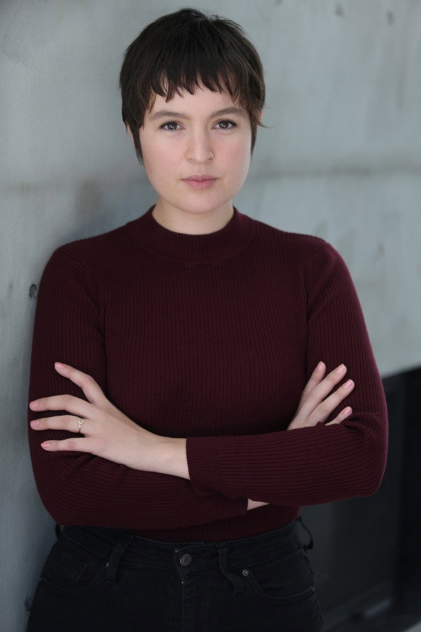 Amanda Morgan as Emily in The Ruck March