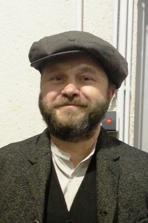 Johann Hallet as Mike in Burkland