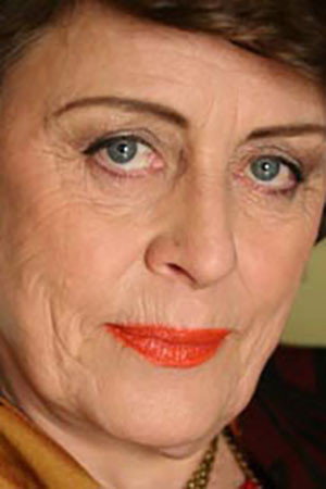 Sheena Larkin as Mrs. Baron in Café Olé