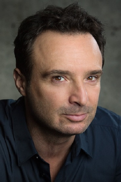 John Cassini as Chief Greg Reed in Love on Fire