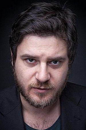 Edoardo Pesce as Dr. Mopsi / Orazio in The Dog Snatch