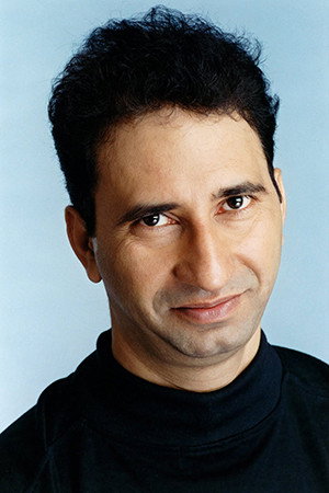 Kurush Deboo as Rohit's Landlord in Bab Al-Hara