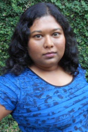 Thushari Jayasekera as Indian News Anchor in The Visitor from Planet Omicron