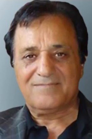 Fereydoun Jourak as Ebi in Resting Against the Wind