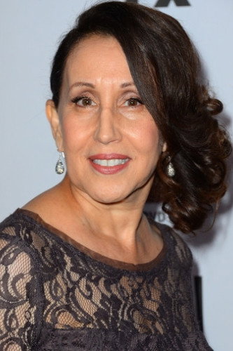 Gloria Laino as Mimi Contreras in How to Rob a Bank