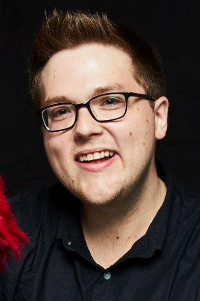 Ryan Dillon as Elmo (voice) in Sesame Street