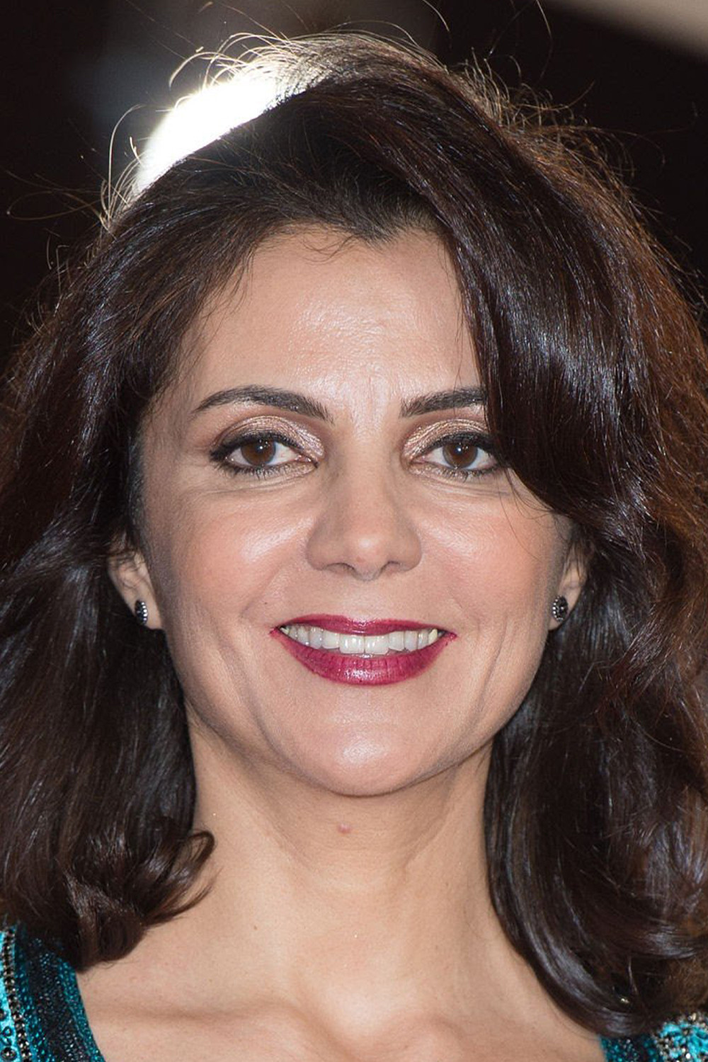 Amal Ayouch as Dr. Maliki in Kandisha