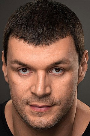 Yevgeniy Kartashov as security guard at the theater in Likes or Dislikes