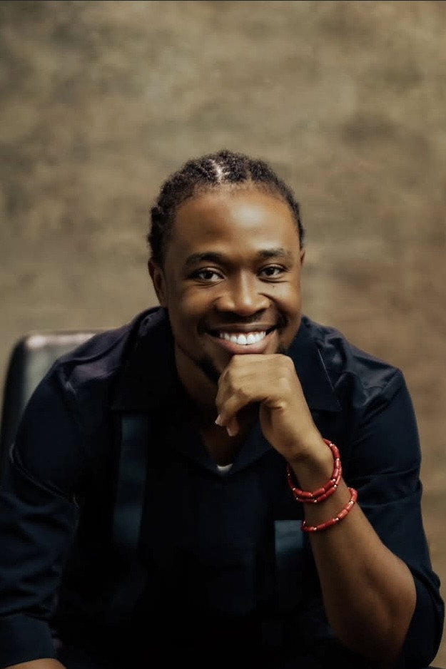 Adio Solanke as Dad in About a Boy and his muse
