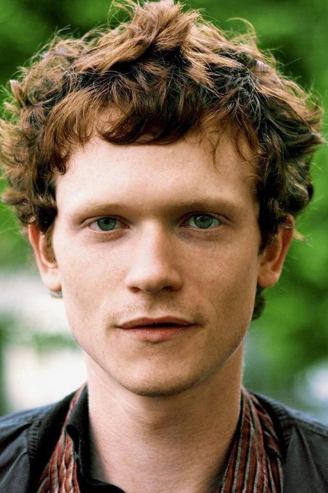 Simon Thomas as Un garçon de la fête in Impure